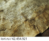 Old parchment paper with illegible writing on it,    Generative AI. Стоковое AI-изображение, AI-художник Анна Кривицкая / Фотобанк Лори