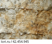 Old parchment paper with illegible writing on it,    Generative AI. Стоковое AI-изображение, AI-художник Анна Кривицкая / Фотобанк Лори