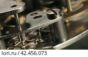 Internal clock mechanism. Macro shot. Стоковое видео, видеограф EStarodubov / Фотобанк Лори