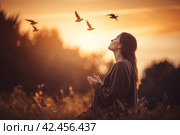 Woman praying sunset view. Generate Ai. Стоковое AI-изображение, AI-художник Иван Рябоконь / Фотобанк Лори