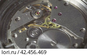 Mechanism of the old wristwatch. Movement of the clockwork pendulum. Macro shot. Стоковое видео, видеограф EStarodubov / Фотобанк Лори