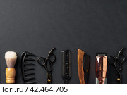 An Assortment of Professional Hairdressing Tools Laid Out on a Dark Surface. Стоковое фото, фотограф Сергей Толмачёв / Фотобанк Лори