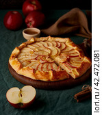 Apple pie, galette with fruits, sweet pastries on dark green tablecloth, vertical. Стоковое фото, фотограф Natalia Gdovskaia / Фотобанк Лори