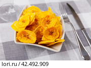 Fried slices of plantains, a traditional and popular snack and accompaniment in Central America. Стоковое фото, фотограф Яков Филимонов / Фотобанк Лори