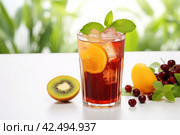 Glass of refreshing tamarind drink and fresh fruits kiwi. Generate Ai. Стоковое AI-изображение, AI-художник Иван Рябоконь / Фотобанк Лори