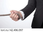 Dispute concept businessman pulling rope office. Generate Ai. Стоковое AI-изображение, AI-художник Иван Рябоконь / Фотобанк Лори