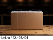 One open cardboard box with bubble wrap order container. Generate Ai. Стоковое AI-изображение, AI-художник Иван Рябоконь / Фотобанк Лори