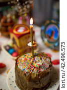 Orthodox Easter. Easter cake, painted eggs, cahors wine and Easter decor on the table in an old village house. (2014 год). Стоковое фото, фотограф Photojuli / Фотобанк Лори