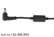 Кабель электропитания с фильтром на белом фоне. Male jack and ferrite bead inductor of power plug adapter on white backgroundd. Стоковое фото, фотограф Татьяна Д / Фотобанк Лори