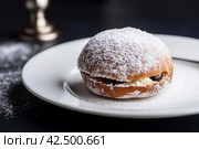 Sufganiyot powdered sugar dessert. Generate Ai. Стоковое AI-изображение, AI-художник Иван Рябоконь / Фотобанк Лори