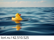 Rubbery duck toy floating in the sea. Generate ai. Стоковое AI-изображение, AI-художник Иван Рябоконь / Фотобанк Лори