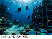 Scuba divers explore sunken ships at the bottom of the sea. Marine life underwater in blue ocean. Observation animal world. Scuba diving adventure in Red sea, coast Africa. Стоковое AI-изображение, AI-художник Aleksandr Golubev / Фотобанк Лори
