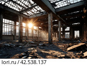 Remains of destroyed industrial building with internal communications. Demolition of building on territory plant. Background with dilapidated building and fragments of bricks and construction debris. Стоковое AI-изображение, AI-художник Aleksandr Golubev / Фотобанк Лори