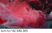 Ink in water. red and blue turquoise ink drops in water and mixes, swirling softly underwater on black background. acrylic cloud paint in aquarium. Abstract smoke explosion animation. Стоковое видео, видеограф Ольга Ильина / Фотобанк Лори