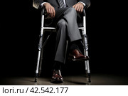 Determined Man injured leg using crutches. Generate Ai. Стоковое AI-изображение, AI-художник Иван Рябоконь / Фотобанк Лори