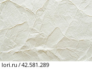 Paper wrinkle background. Texture of luxury white regular paper, capturing the subtle fibers and surface irregularities typical of standard paper. Closeup. Designs decoration, nature backdrop concept. Стоковое AI-изображение, AI-художник Марина Демидюк / Фотобанк Лори