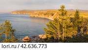 Baikal Lake in August. Panoramic view of coast of Olkhon Island at sunset light. Scenic landscape. Natural background. Summer travel, hiking and outdoor recreation. Стоковое фото, фотограф Виктория Катьянова / Фотобанк Лори
