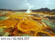 Hot hydrothermal springs with bright mineral deposits in a volcanic area in the desert. Стоковое AI-изображение, AI-художник Евгений Харитонов / Фотобанк Лори