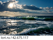 Atmospheric scenery Dramatic Baltic sea, waves and water splashes on breakwaters. Nature north cloudscape on coast ocean. Environment with fickle weather, climate change. Stormy, abstract backgrounds. Стоковое AI-изображение, AI-художник Aleksandr Golubev / Фотобанк Лори