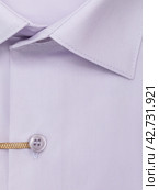 Close-up of a button placket on a light purple men's dress shirt, top view. Стоковое фото, фотограф Сергей Чайко / Фотобанк Лори
