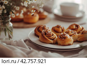 Cinnamon buns on a Scandi table. Image for cafe menu, Banner. Стоковое AI-изображение, AI-художник Ирина Ручушкина / Фотобанк Лори
