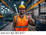 An engineer wearing glasses, a yellow vest and a protective helmet shows his thumb. The symbol is fine. Стоковое AI-изображение, AI-художник Ярославский Максим / Фотобанк Лори