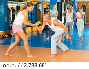 Young woman training wristlock movement. Стоковое фото, фотограф Яков Филимонов / Фотобанк Лори