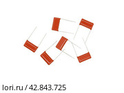 Ceramic electronic capacitors for soldering to a printed circuit board are isolated on a white background. Стоковое фото, фотограф Сергей Н / Фотобанк Лори