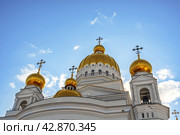 Saransk, Russia - June 5, 2023. Cathedral of St. Theodore Ushakov in Saransk, Russia. It is named after the Russian saint and admiral Fyodor Ushakov. The inscription above the entrance of the Cathedral of the Holy Righteous Warrior Theodore Ushakov. Редакционное фото, фотограф Оксана Медведева / Фотобанк Лори