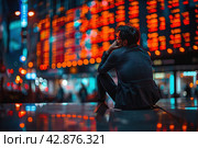 A man in a business suit looks thoughtfully at the busy streets of the city with bright neon lighting. This image is full of atmosphere and can be interpreted as a moment of reflection on life's journey or as a break from the fast pace of modern life. Стоковое AI-изображение, AI-художник Анна Кривицкая / Фотобанк Лори
