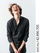 Joyful Young Man Laughing. Стоковое AI-изображение, AI-художник Кирилл Черезов / Фотобанк Лори