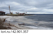 Petrozavodsk, Russia 04.14.24 Ice drift in spring Lake Onega, Karelia. Port and berths for ships. Aggregate accumulations of fine-crystalline grains. Opening of small lakes, ponds. Crushed ice floes. (2024 год). Редакционное видео, видеограф Юлия Петровская / Фотобанк Лори