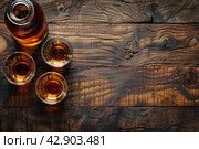 Glasses and bottle of whiskey on a wooden table, Стоковое AI-изображение, AI-художник Анна Кривицкая / Фотобанк Лори