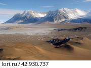 Aerial view of a dry valley in Antarctica. Стоковое AI-изображение, AI-художник Евгений Харитонов / Фотобанк Лори