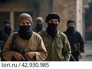 Terrorists with a machine gun on the background of military operations.Isis is a terrorist. Стоковое AI-изображение, AI-художник Александр Поташев / Фотобанк Лори