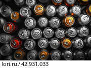Color Abstract pattern many soda drinks cans top view on dark background. Recycling aluminum or metal empty cans from above. Group of cans for reuse and recycle. Стоковое AI-изображение, AI-художник Ирина Михайличенко / Фотобанк Лори