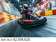 a male kart racer drives quickly along the autodrome track, blurred background. Стоковое AI-изображение, AI-художник Александр Довянский / Фотобанк Лори
