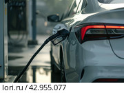 Car fueling at the gas station. Refuel fill up with gasoline. Petrol pump filling fuel nozzle in fuel tank of white car. Rising price, oil industry crisis. Auto Service. Transmission, Maintenance Gear. Стоковое AI-изображение, AI-художник Марина Демидюк / Фотобанк Лори