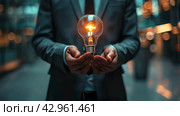 Man Holding Light Bulb. Стоковое AI-изображение, AI-художник Юлия Гапеенко / Фотобанк Лори