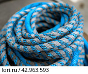 Coiled Blue and Grey Rope. Стоковое AI-изображение, AI-художник Кирилл Черезов / Фотобанк Лори