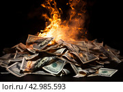 Wasteful Pile dollars burning. Generate Ai. Стоковое AI-изображение, AI-художник Иван Рябоконь / Фотобанк Лори
