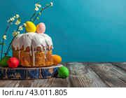 Easter cake and colorful Easter eggs. Easter spring background. Copy space. Стоковое AI-изображение, AI-художник Ярославский Максим / Фотобанк Лори