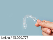 Transparent Dental Clear Aligners on Blue. Invisible Braces. Prevention Gums Treatment. Retainers for Dentistry Correction. Invisalign Orthodontics concept. Alignment of Teeth. Dentofacial Orthopedics. Стоковое фото, фотограф Марина Демидюк / Фотобанк Лори