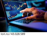 The trader's manager's hand on the laptop keyboard points to a monitor with a chart of exchange rates. Стоковое AI-изображение, AI-художник Ярославский Максим / Фотобанк Лори