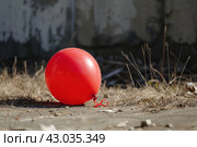 Incongruous Air balloon deflated in nature field. Generate Ai. Стоковое AI-изображение, AI-художник Иван Рябоконь / Фотобанк Лори