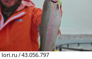 Arctic Aquaculture: Celebrating a Snow-Dusted Catch of Trout. Стоковое видео, видеограф Даниил Хабаров / Фотобанк Лори