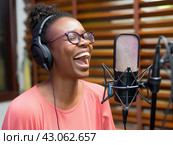 Joyful Singer Recording in Studio. Стоковое AI-изображение, AI-художник Кирилл Черезов / Фотобанк Лори