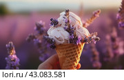 Hand holding ice cream with lavender filed background. Стоковое AI-видео, аниматор Ирина Михайличенко / Фотобанк Лори