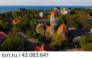 Svetlogorsk, Russia - May 1, 2024: Water tower Rauschen top ariel view. Редакционное фото, фотограф Наталья Симакова / Фотобанк Лори