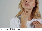 Woman with pain in thyroid gland. Human body health problem banner. Female person is enduring ache holding a hand on painful zone. Upset lady with treatment of thyroid diseases symptoms. Endocrinology. Стоковое AI-изображение, AI-художник Марина Демидюк / Фотобанк Лори
